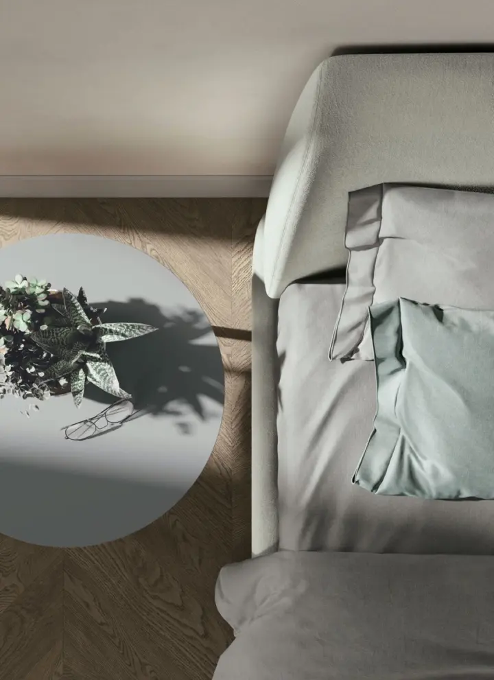 Letto imbottito visto dall'alto, con rivestimento e biancheria nei toni del verde salvia