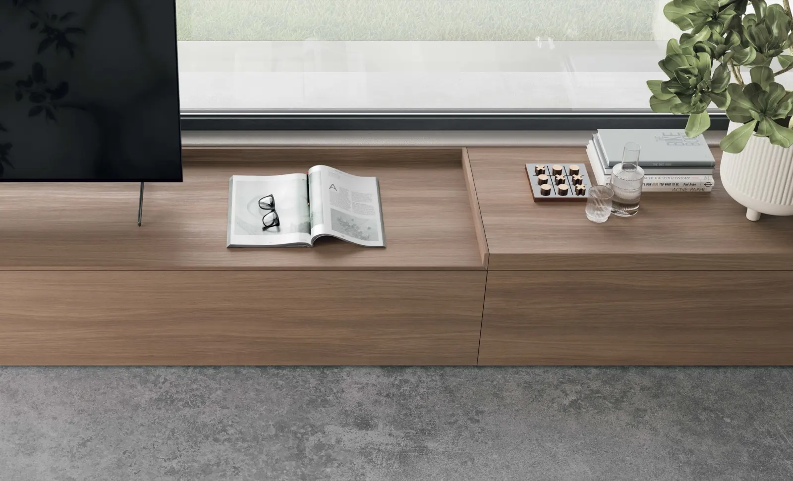 Piano di una madia in legno con un libro aperto e oggetti d'arredo